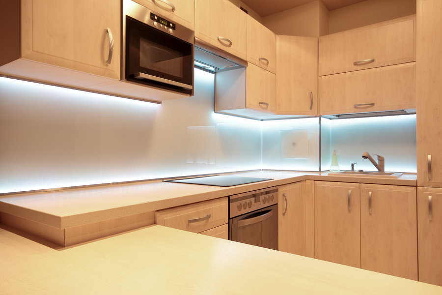 Image is of a modern kitchen with under-cabinet lighting.